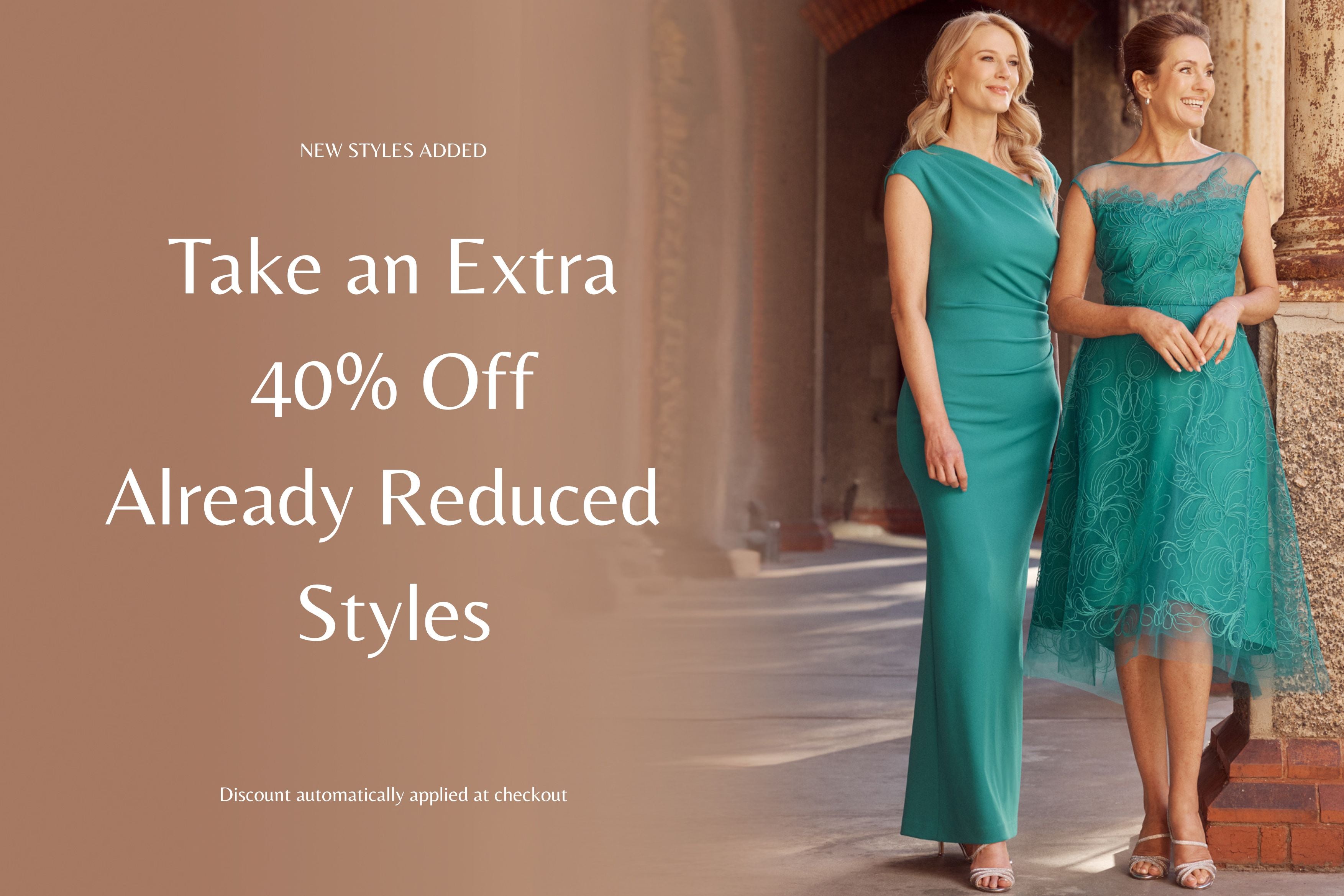Two women in teal dresses standing in a hallway with promotional text overlay. Take an Extra 40% Off Already Reduced Styles.