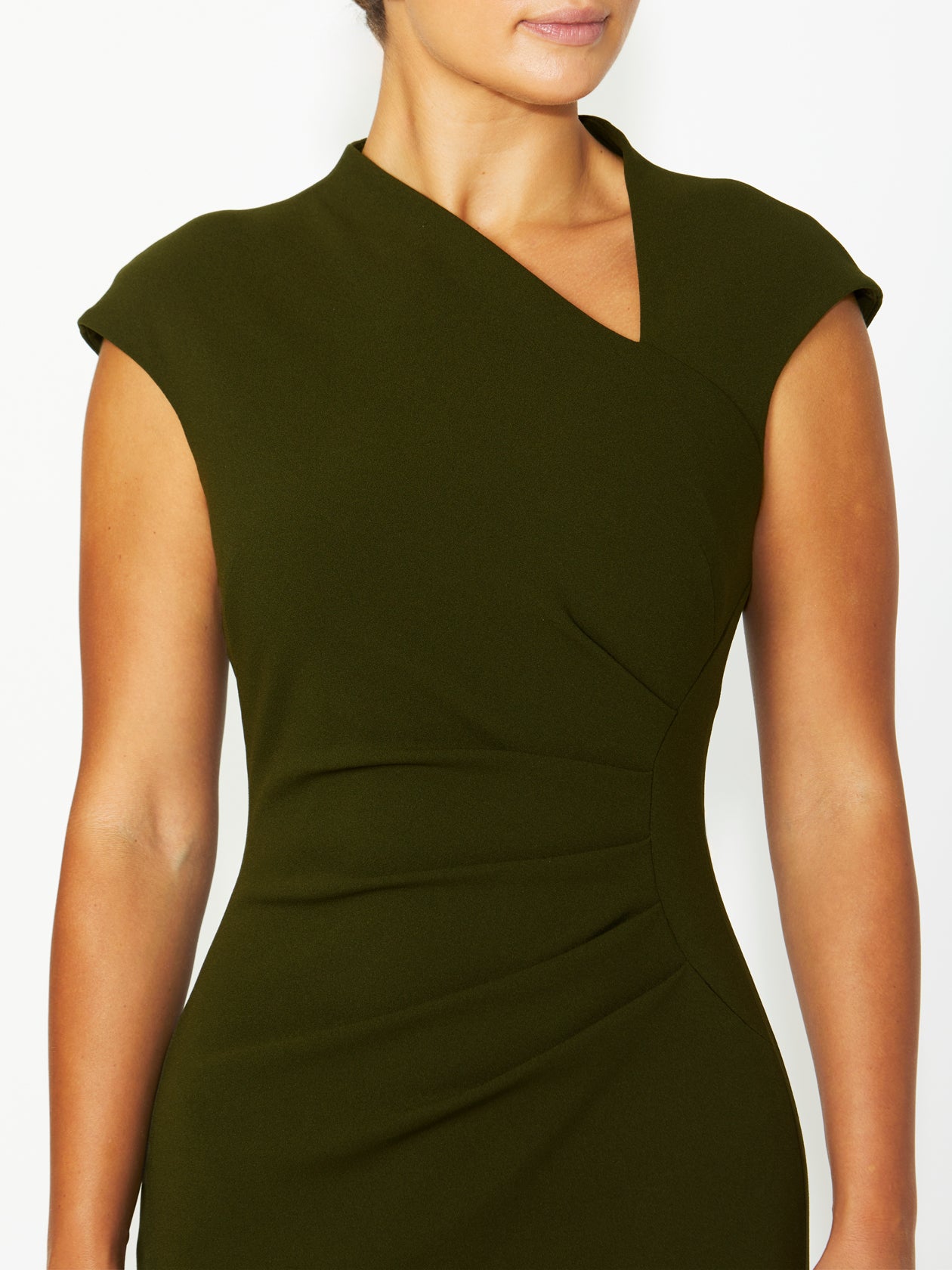 A close-up of the Selene Dark Olive Dress focusing on the asymmetrical neckline and delicate ruched fabric detailing at the waist.