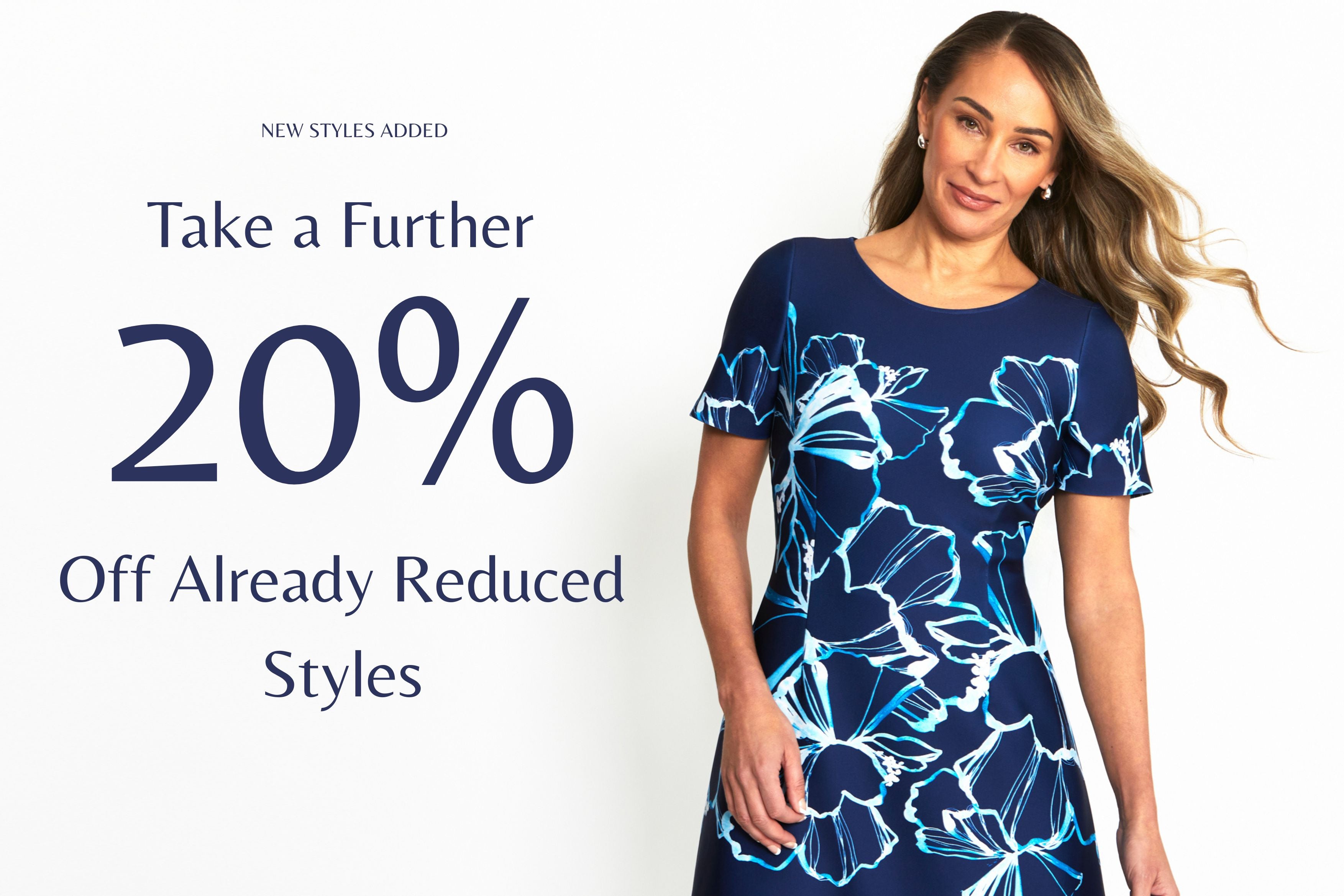 Woman wearing a blue floral dress with promotional text on a white background. Take a Further 20% Off Already Reduced Styles | New Styles Added- Mandy Onyx Scuba Dress